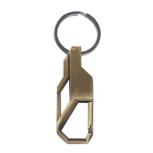 Metal car keychain detail view, vintage bronze geometric pendant close-up, sturdy metal ring.