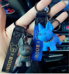 French bulldog keychain detail view showing cute cartoon puppy pendant and strap design.