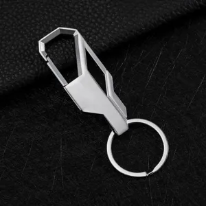 Detailed close-up of the silver metal car keychain with geometric hook and round ring.