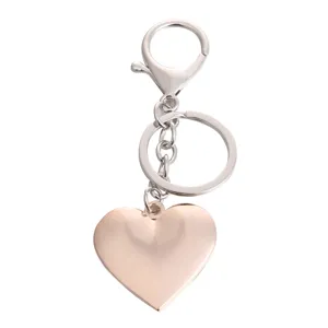 Metal heart keychain with lobster clasp, stylish romantic gift pendant for couples and friends.