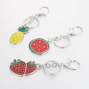 Cute fruit metal keychain set featuring pineapple, watermelon, and strawberry charms for bags.