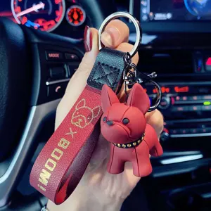 Cute French Bulldog cartoon keychain for women, red leather strap car key ring ornament.
