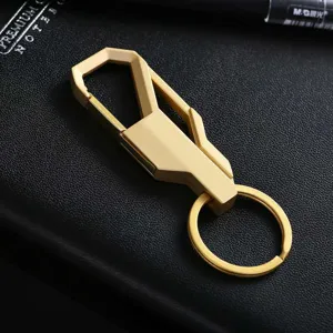 Gold metal car keychain detail view, stylish geometric key ring pendant for daily use.