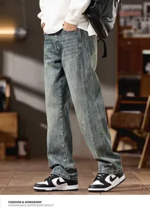 Retro washed distressed splash ink denim jeans detail view showing relaxed straight fit.