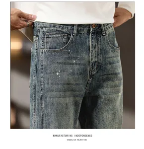 Retro washed ink splash denim jeans detail shot showcasing vintage texture and fit.