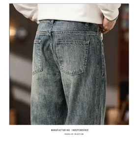 Men's vintage washed denim jeans detail, loose straight fit, classic back pockets style.