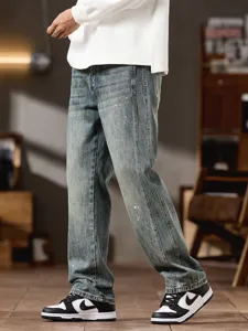 Vintage washed paint splatter straight leg jeans for men, loose casual denim pants.