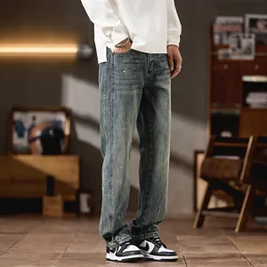 Vintage washed paint splatter men's jeans, loose fit straight leg denim trousers for autumn.
