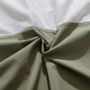 Close-up detail of the breathable mesh lining and durable fabric on this tactical shirt.