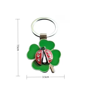 Metal rhinestone four-leaf clover ladybug keychain detail view, high quality accessory.