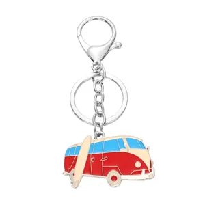 Metal camper van keychain detailed view, showing colorful enamel and silver clasp pendant.