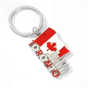 Close-up of Canada flag Toronto skyline metal keychain souvenir pendant detail shot.