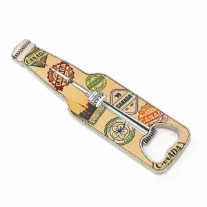 Metal bottle opener with Canada tourism stamps and CN tower design souvenir keychain.