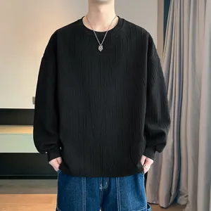 Men's black casual long sleeve sweatshirt with embossed letter pattern for autumn season.