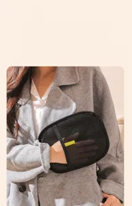 Pet hair removal glove detail view showing breathable black mesh fabric and comfortable grip.