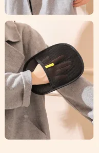Close-up detail of the black mesh pet hair removal glove showing breathable fabric texture.
