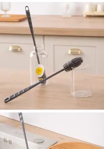 Brosse à tasse en silicone à long manche pour nettoyer facilement les tasses et biberons.