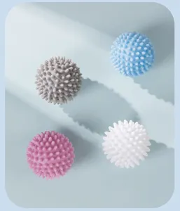 Close-up detail shot of colorful spike laundry balls, anti-tangling cleaning accessories.