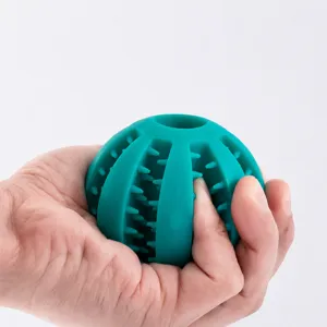 Durable silicone dog chew toy interactive treat ball for pet teeth cleaning and puzzle play.