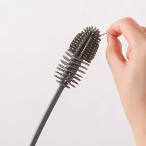 Brosse à tasse en silicone à long manche pour nettoyer facilement les bouteilles et les tasses.