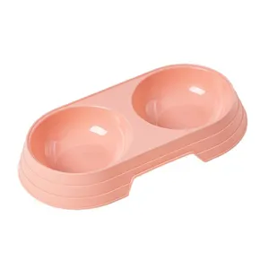 Pink plastic double pet bowl for cats and dogs, dual-use food and water feeding basin.