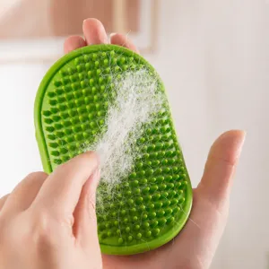 Green silicone pet bath brush for cats and dogs grooming massage and removing loose floating hair.