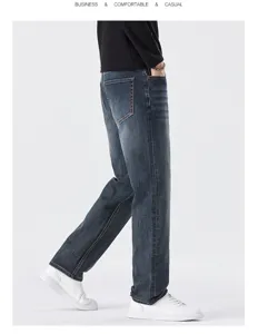 Men's dark blue straight fit denim jeans side view, business casual stretch trousers for autumn.