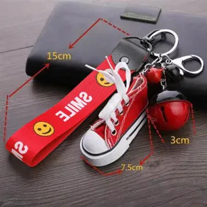 Mini canvas sneaker keychain with red strap, cute bag charm and metal bell pendant for cars.