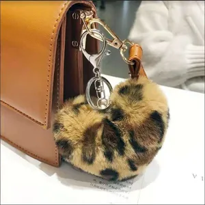 Leopard print heart shaped faux fur plush bag charm keychain accessory detail view.