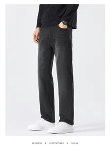 Detail view of men's dark grey straight casual trousers, showing fit and fabric texture.