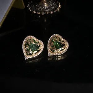 Retro gold heart earrings with green glass, leaf carving and crystal border. Elegant jewelry.