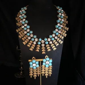 Vintage turquoise statement necklace and earrings set featuring intricate gold wheat leaf tassels.
