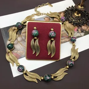 Vintage gold-tone leaf green stone beaded necklace and earrings jewelry set for women.