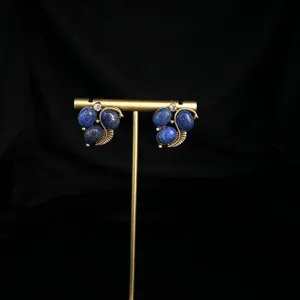 Close-up detail view of vintage lapis lazuli earrings with sparkling rhinestone accent.