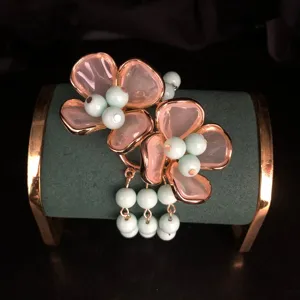 Exquisite four-petal flower bracelet with pink enamel and mint green beads elegant design