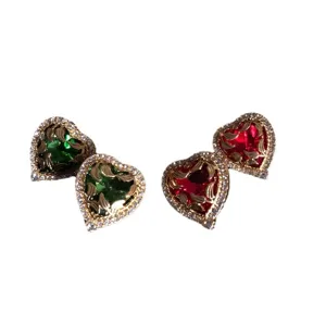 Retro heart-shaped crystal stud earrings with gold-plated carved floral design and sparkling rhinestones.
