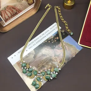 Vintage retro chunky gold chain necklace with green stone and clear rhinestones for women.