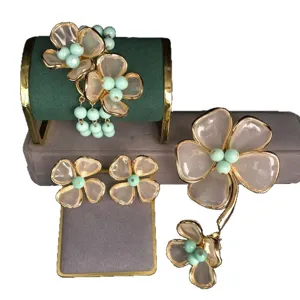 Exquisite fashion flower jewelry set featuring elegant pink petals and mint green beaded accents.