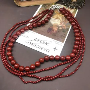 Vintage multi-strand red bead necklace with rhinestone clasp elegant retro statement jewelry