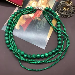 Exquisite multi-layer green malachite bead necklace detail shot, vintage retro style jewelry.