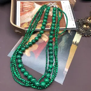 Vintage multi-strand green malachite bead statement necklace with sparkling rhinestone clasp.