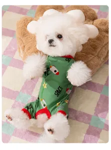 Detail view of green space themed four-legged dog jumpsuit, warm pet clothes for small dogs.
