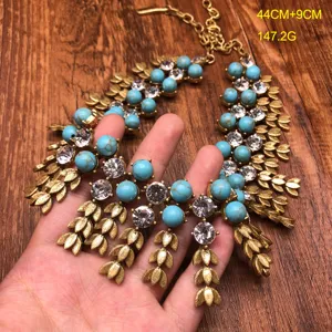 Vintage heavy turquoise rhinestone wheat leaf statement necklace close up detail view