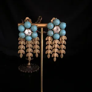 Vintage turquoise gemstone clip-on earrings with gold wheat tassels, detailed jewelry.