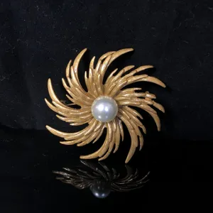 Vintage gold swirl pearl brooch, elegant copper metal flower pin for women daily wear.