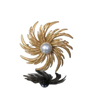 Vintage gold-toned swirling pearl brooch pin, elegant retro costume jewelry for women's outfits.