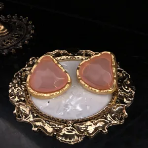 Vintage jelly effect pink earrings with elegant gold frames, perfect for chic daily wear.