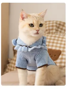Cozy blue knitted cat sweater with cute ruffles for autumn winter pet apparel daily wear.