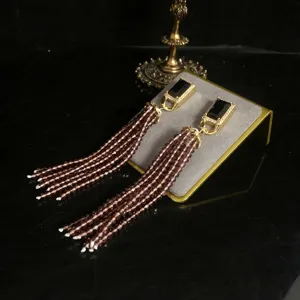 Retro long fringe earrings detailed shot, chic copper rhinestone bead tassel design for daily wear.
