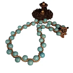Vintage turquoise beaded necklace with gold twisted chain, elegant vintage jewelry design.